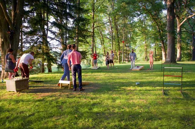 Camp Woodbury guests playing cornhole