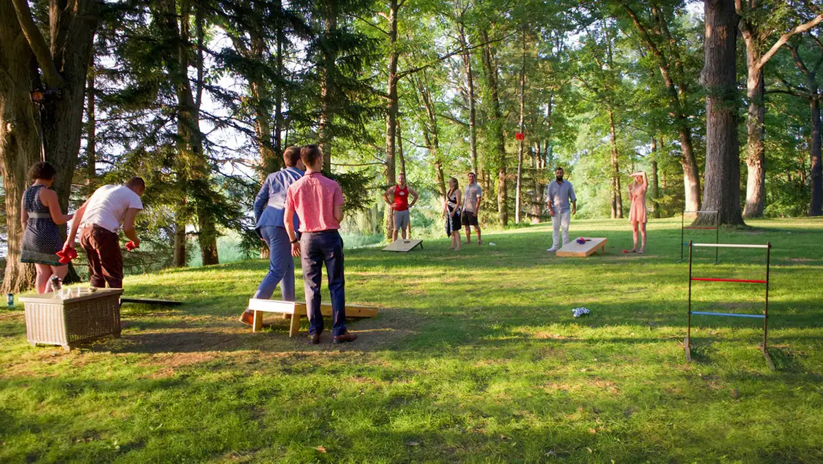 family-playing-yard-games friends and family playing lawn games at Camp Woodbury