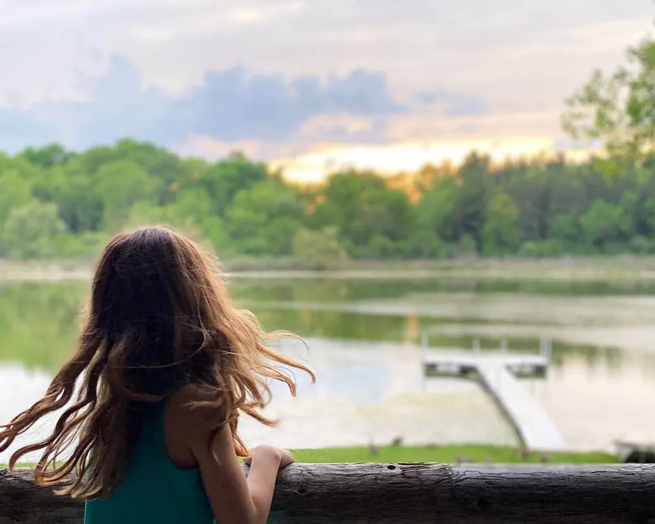 girl watching the sunset over Nordman Lake