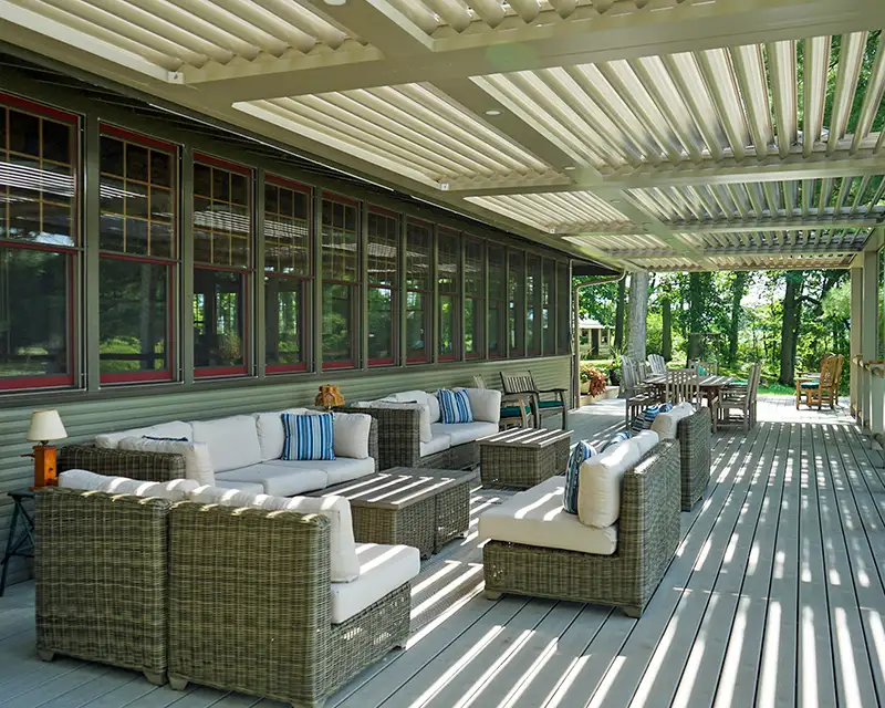 the back deck of the lodge at Camp Woodbury on a summer afternoon